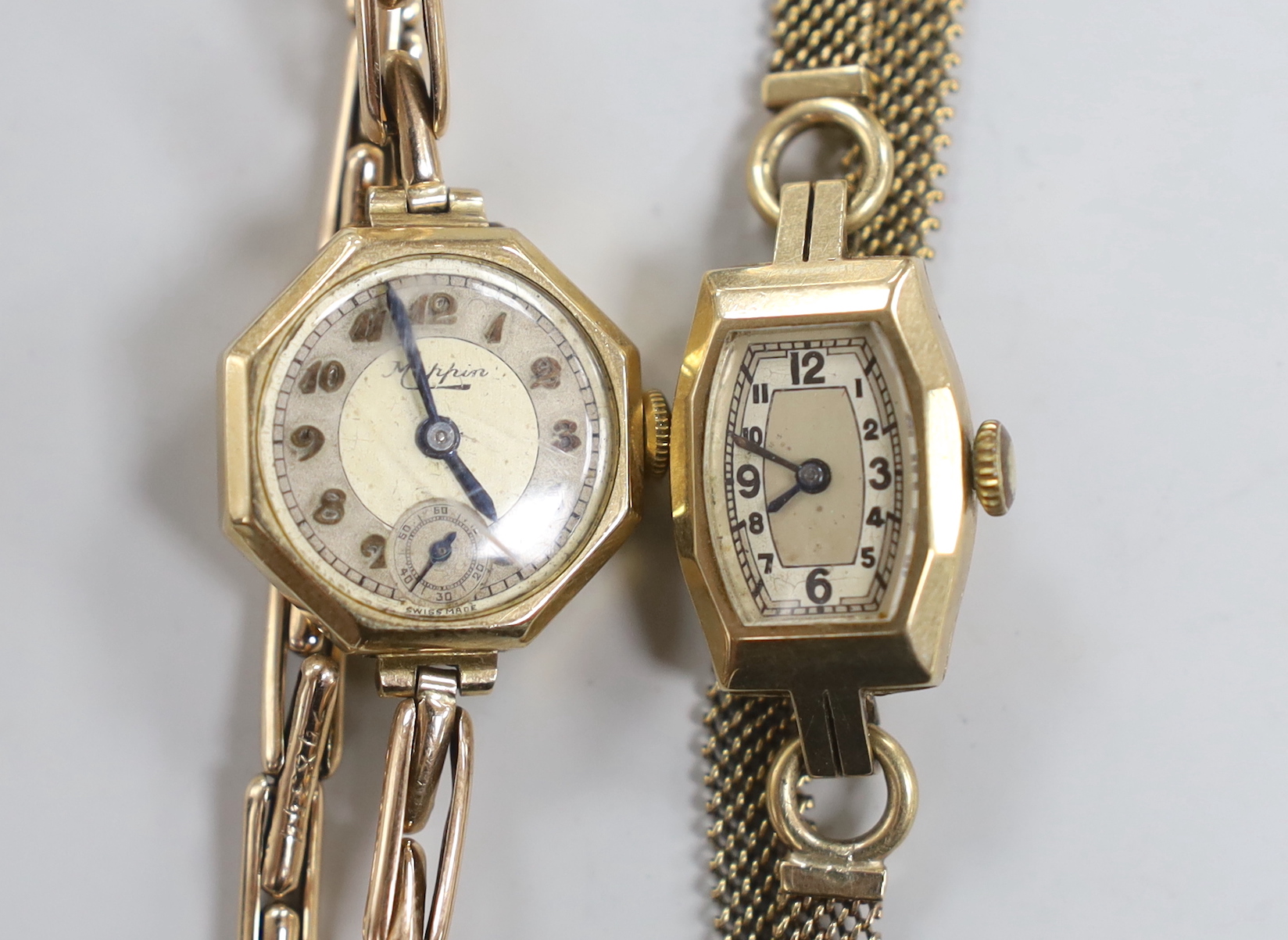 Two lady's 9ct manual wind wrist watches, one with 9ct gold bracelet, the other retailed by Mappin on an expanding yellow metal bracelet.